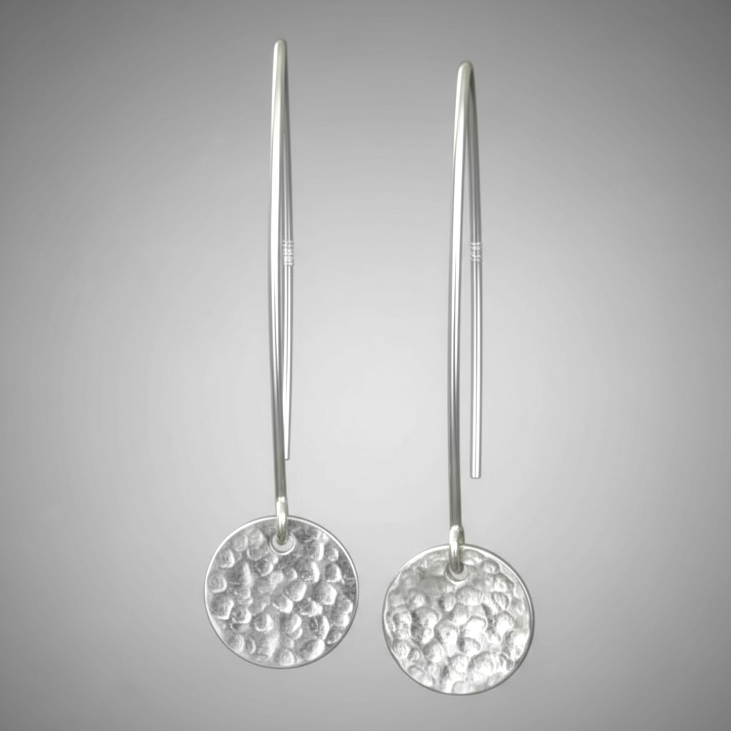 Hammerd sterling silver disc dangle earrings.
