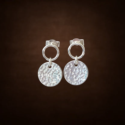 Sterling silver circle and hammered disc stud earrings.