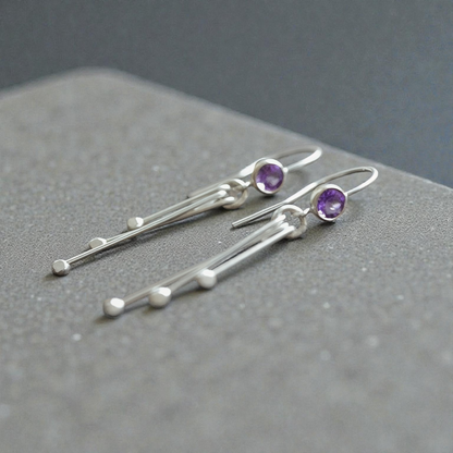 Amethyst birthstone sterling silver dangle earrings.