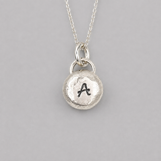 Pebble solid sterling silver personalised letter necklace.