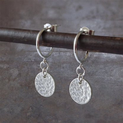 Sterling silver disc charm half hoop earrings.