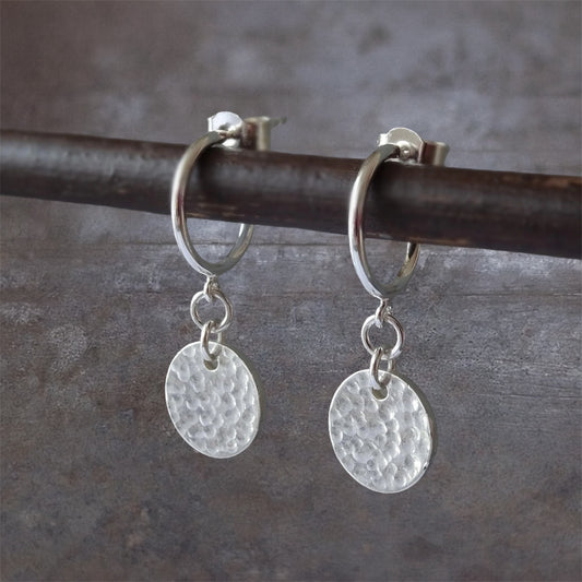 Sterling silver disc charm half hoop earrings.