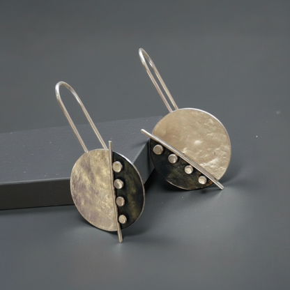 Large sterling silver disc earrings.