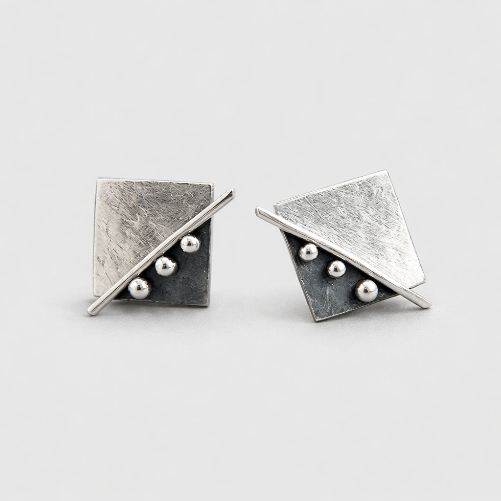 Square stud earrings in sterling silver.