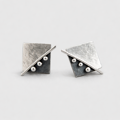 Square stud earrings in sterling silver.