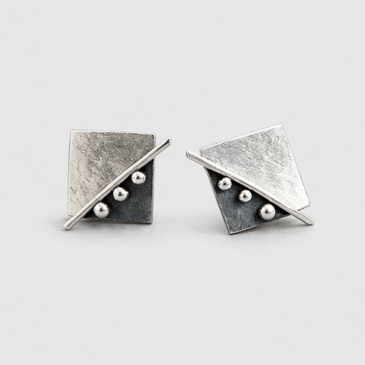 Square stud earrings in sterling silver.