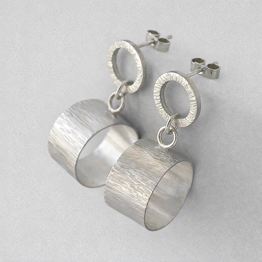 Sterling silver circle stud earrings.