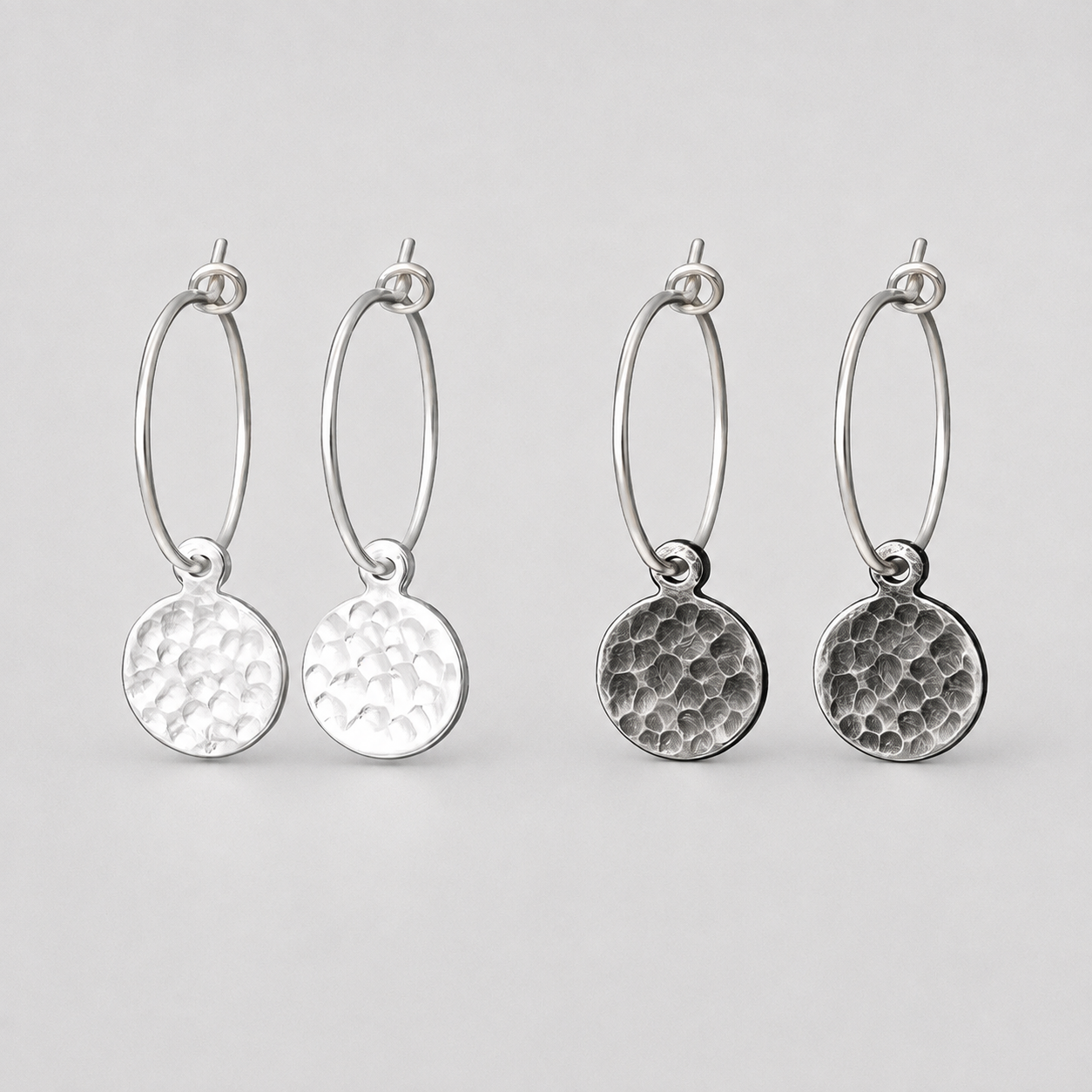 Hammered sterling silver disc charm hoop earrings.