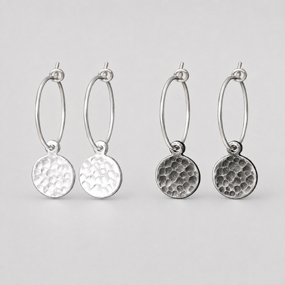 Hammered sterling silver disc charm hoop earrings.