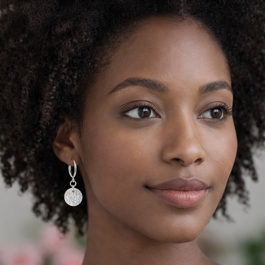 Sterling silver disc charm half hoop earrings.