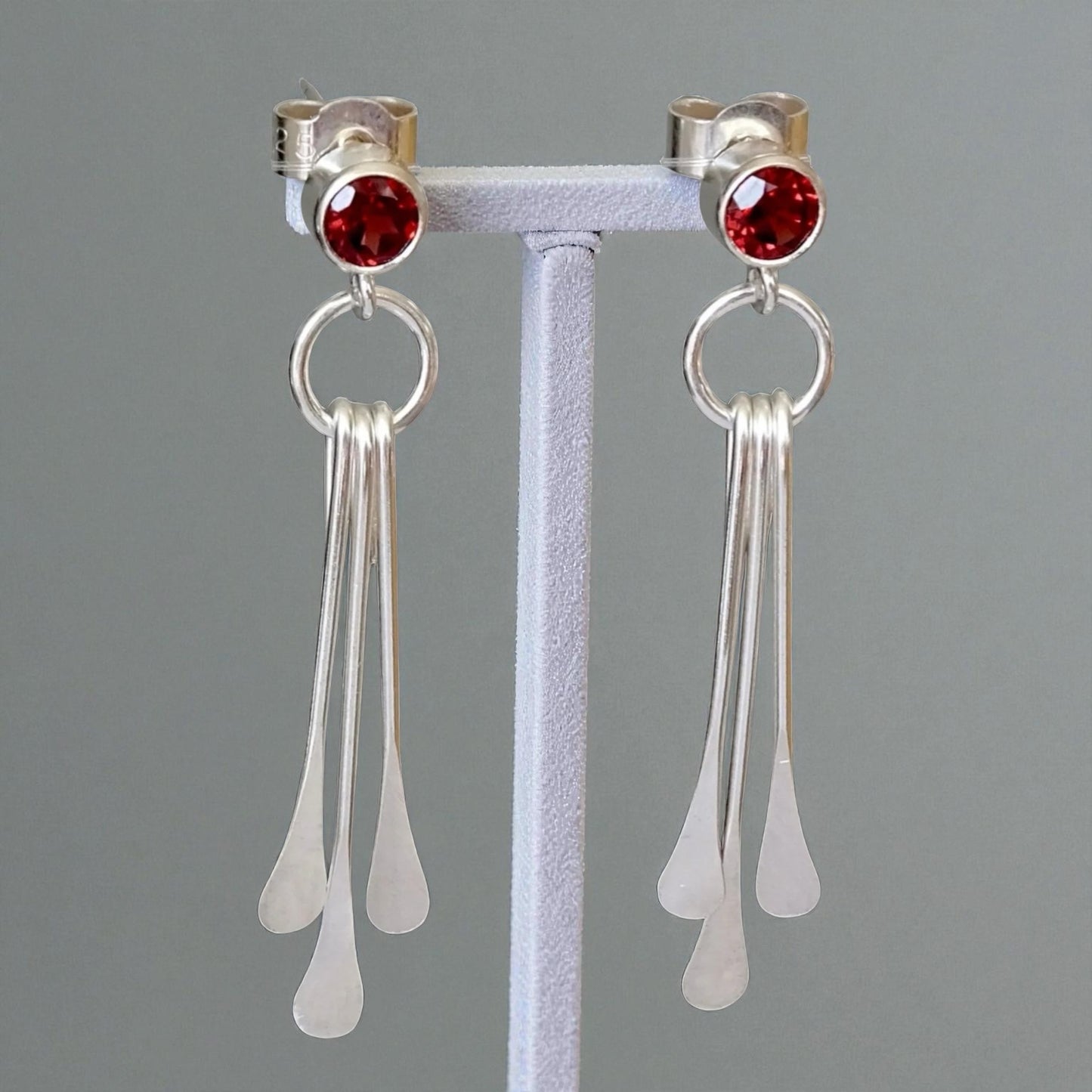 Garnet sterling silver dangle stud earrings.