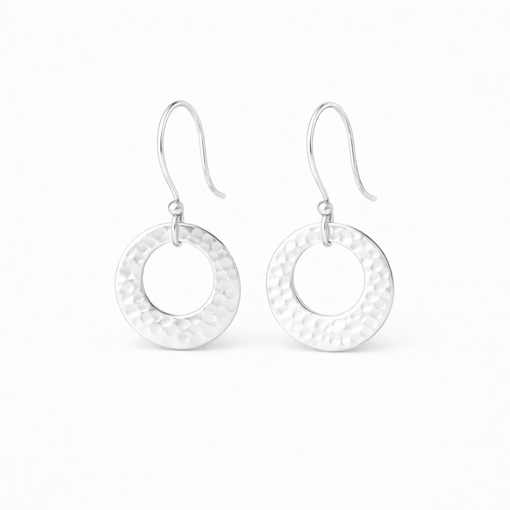Hammered circle sterling silver earrings.