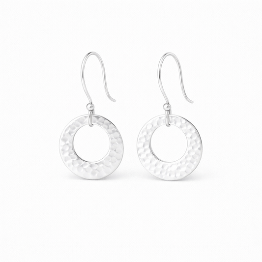 Hammered circle sterling silver earrings.