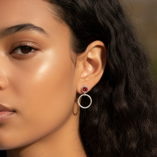 Garnet sterling silver circle earrings.