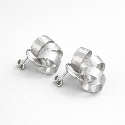 Sterling silver circle stud earrings.