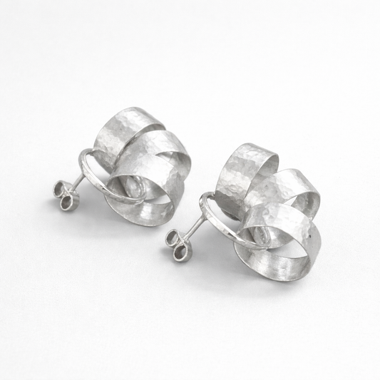 Sterling silver circle stud earrings.
