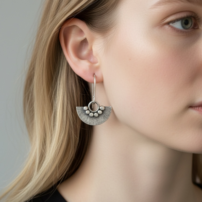 Sterling silver dangle fan earrings.