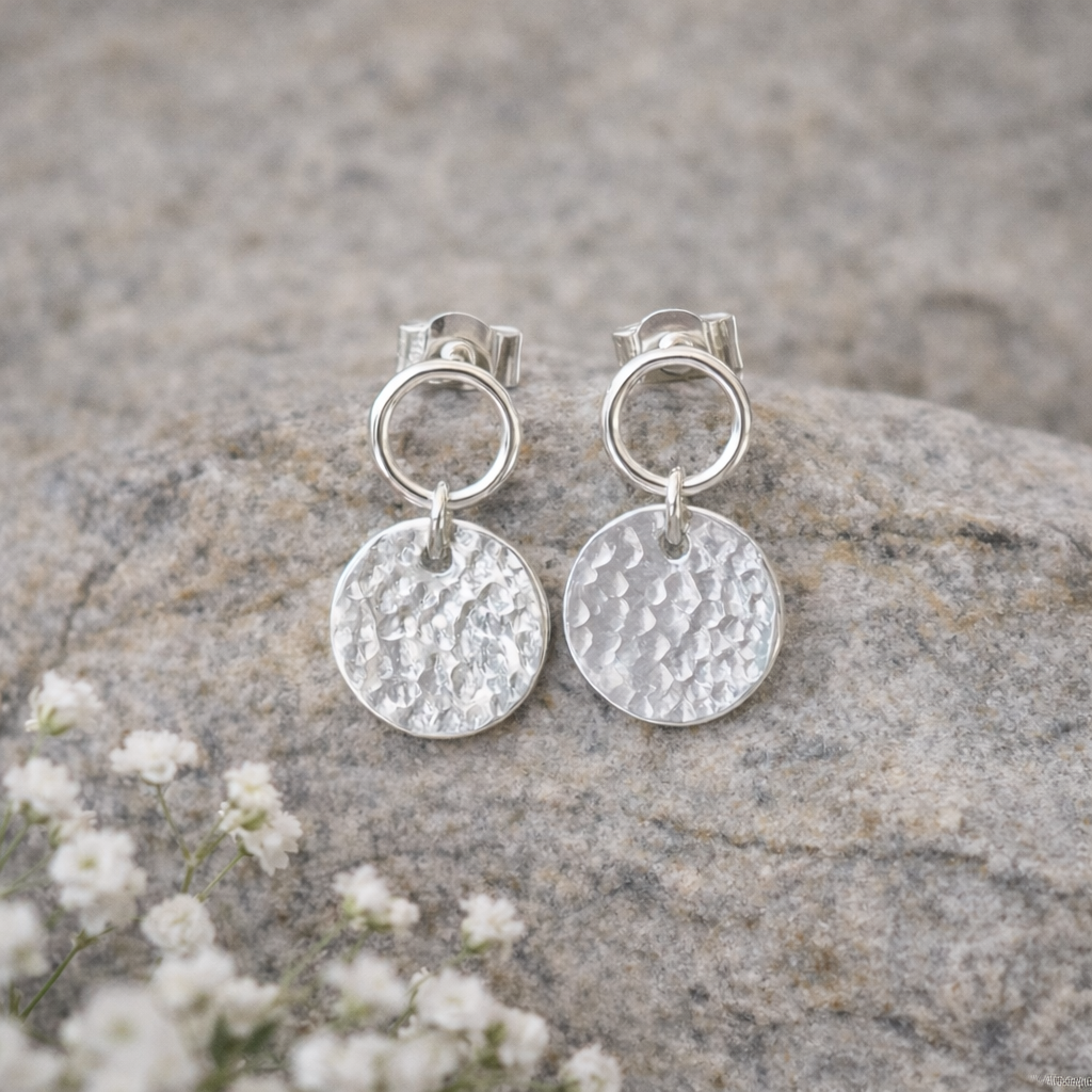 Sterling silver circle and hammered disc stud earrings.
