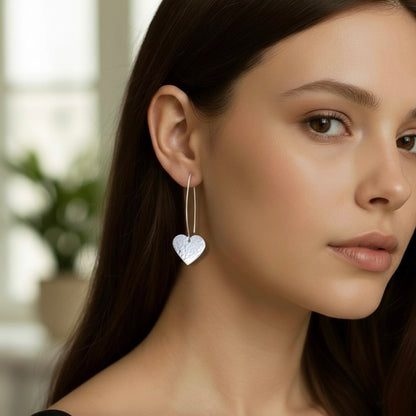 Sterling silver dangle heart earrings