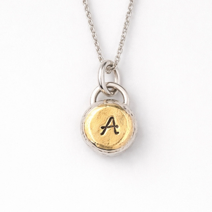 Personalised initial organic sterling silver pebble necklace.