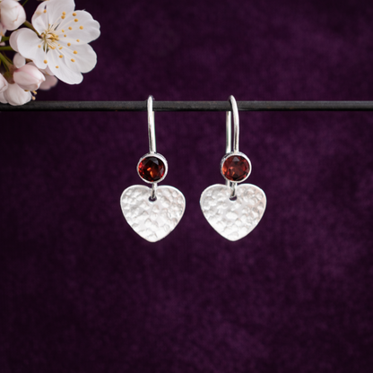 Garnet sterling silver heart dangle earrings.