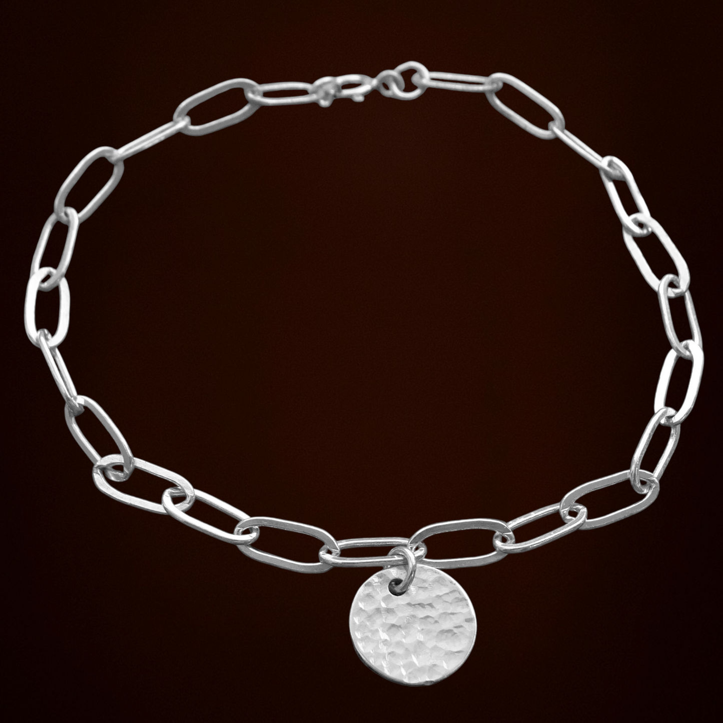 Sterling silver disc charm cable chain bracelet.