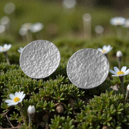 Minimalist sterling silver hammered disc stud earrings.