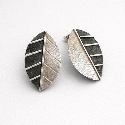 Sterling silver leaf stud earrings.