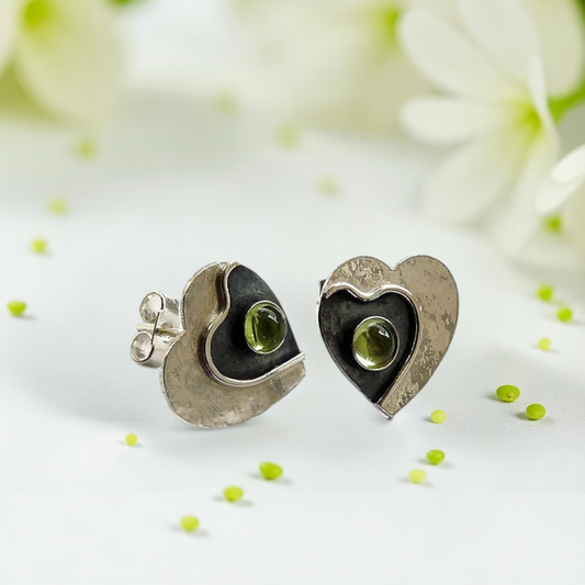 Peridot sterling silver heart stud earrings.