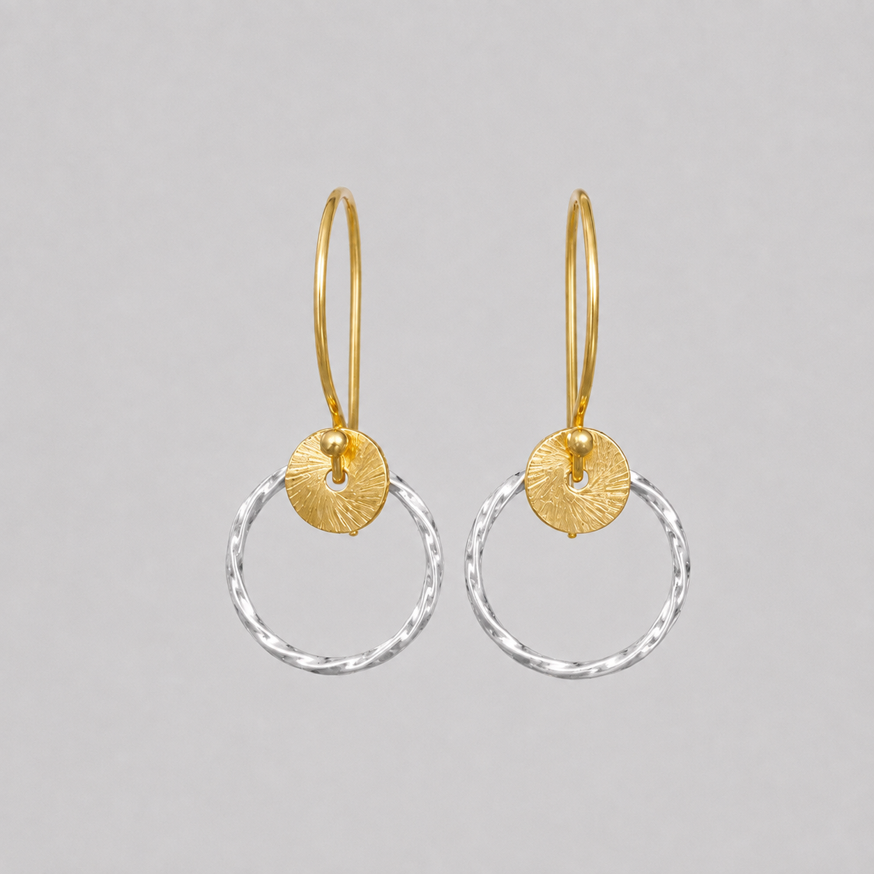 Sterling silver twisted circle earrings.