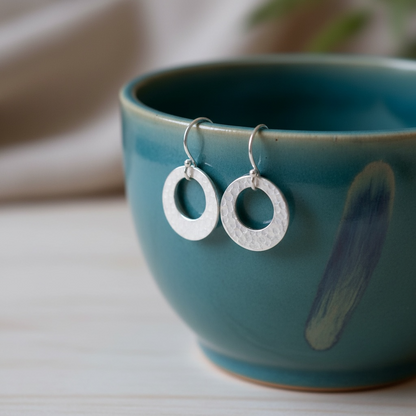 Hammered circle sterling silver earrings.
