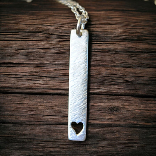Hammered heart sterling silver rectangular necklace.