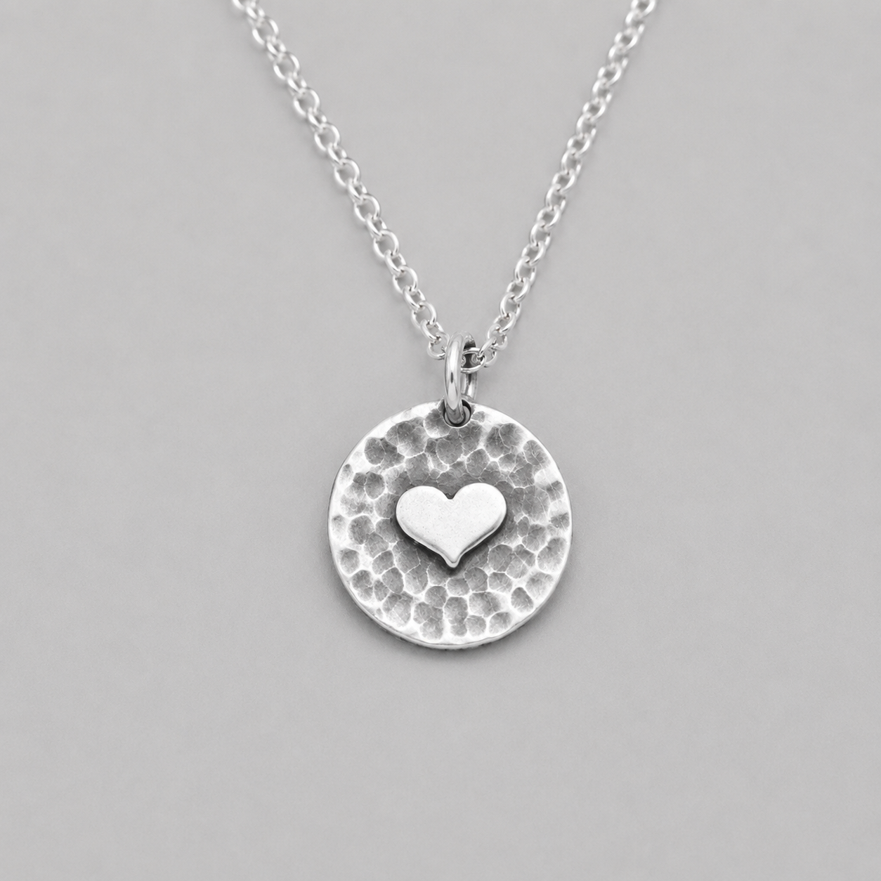 Sterling silver heart disc pendant