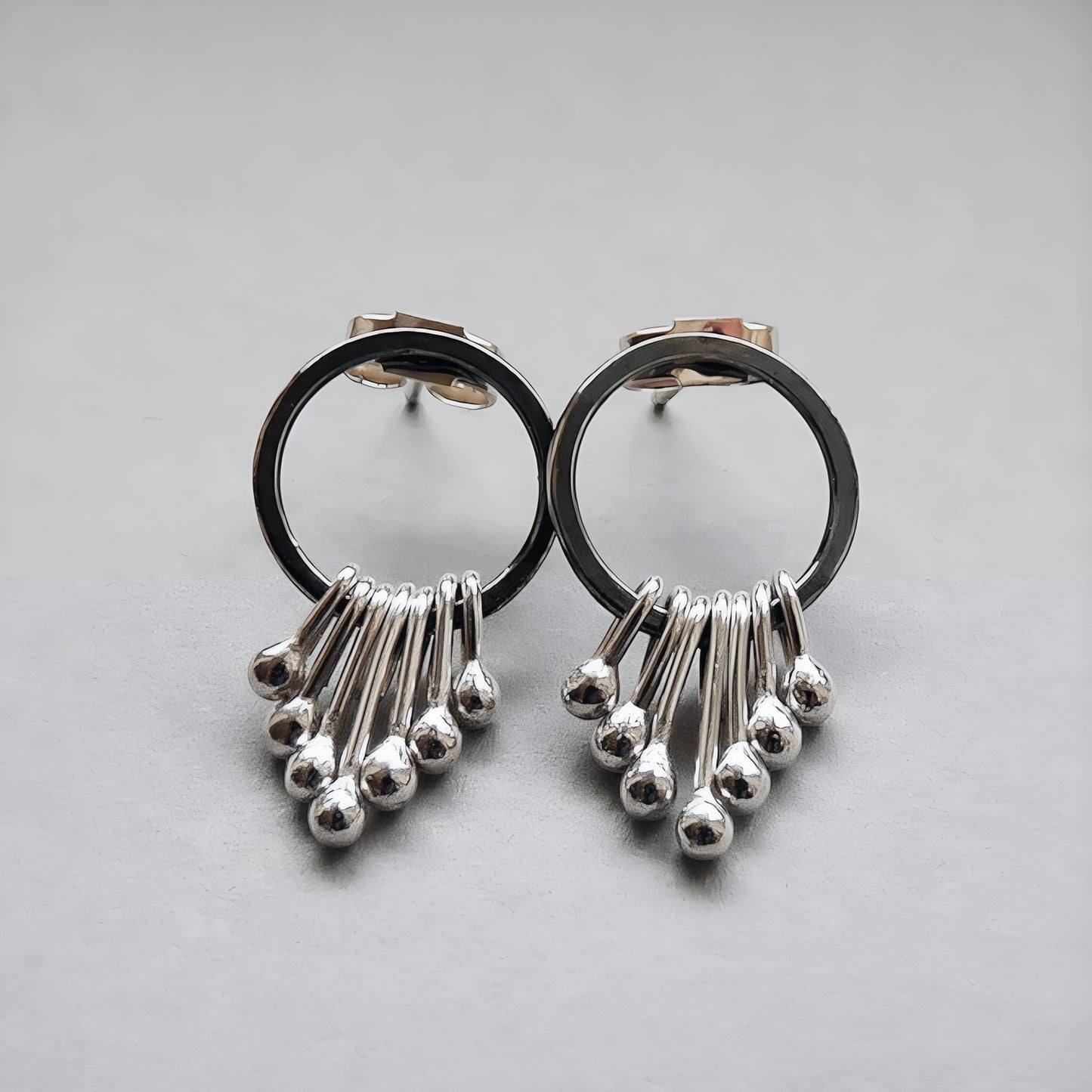 Sterling silver oxidised circle dangle studs.