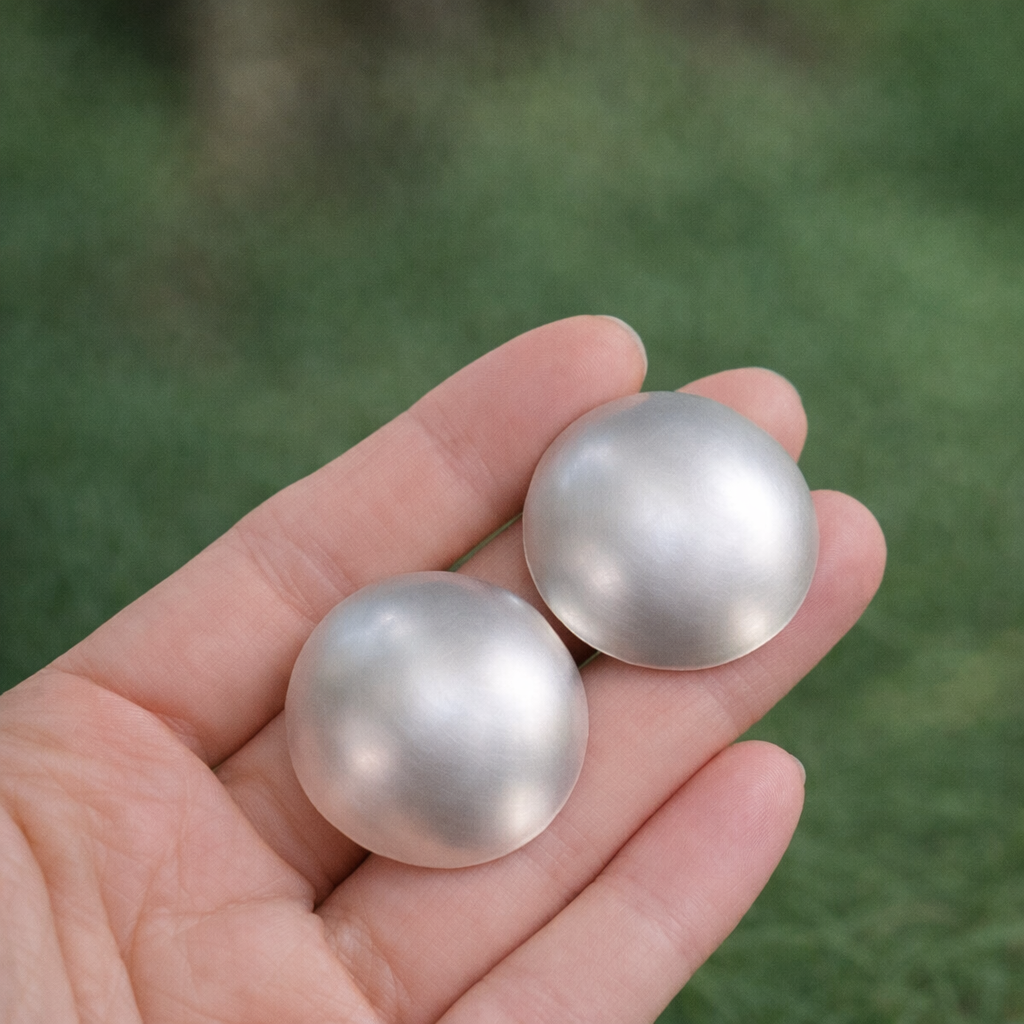 Large statement sterling silver bowl stud earrings.