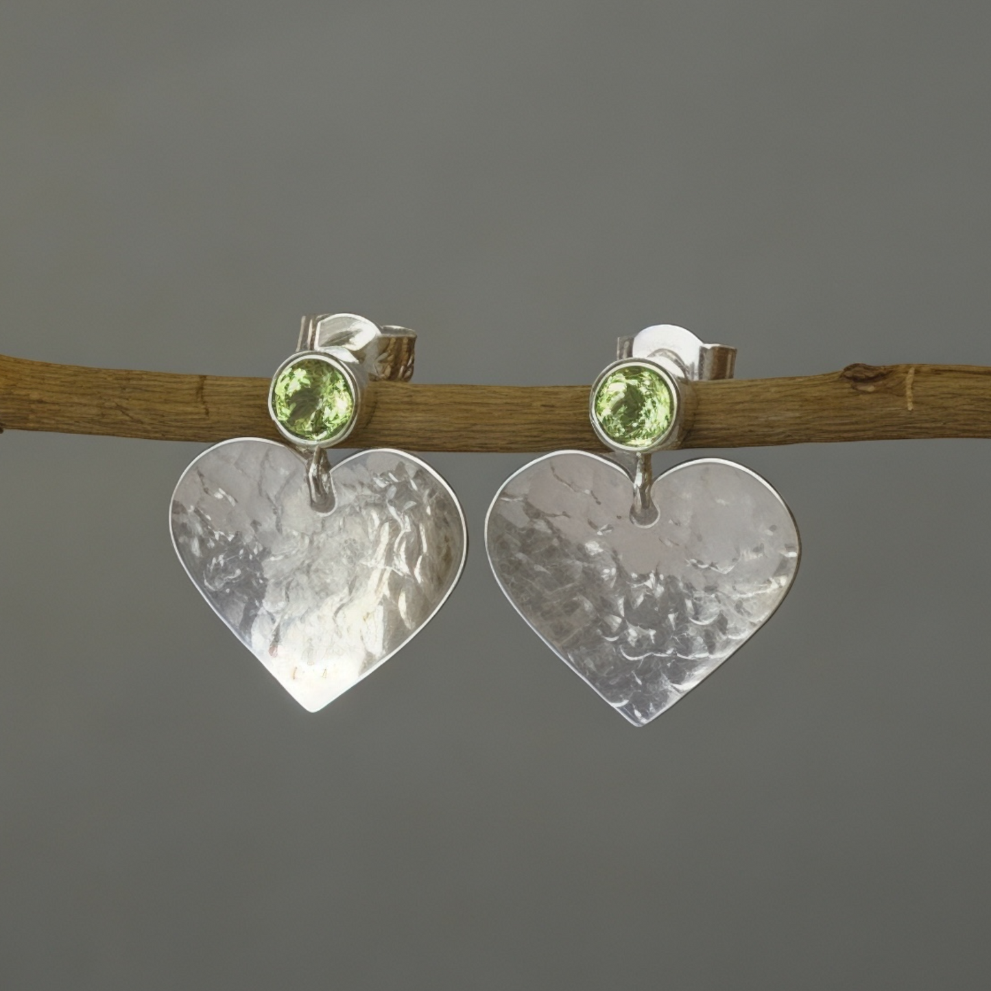 Peridot August birthstone sterling silver heart stud earrings.