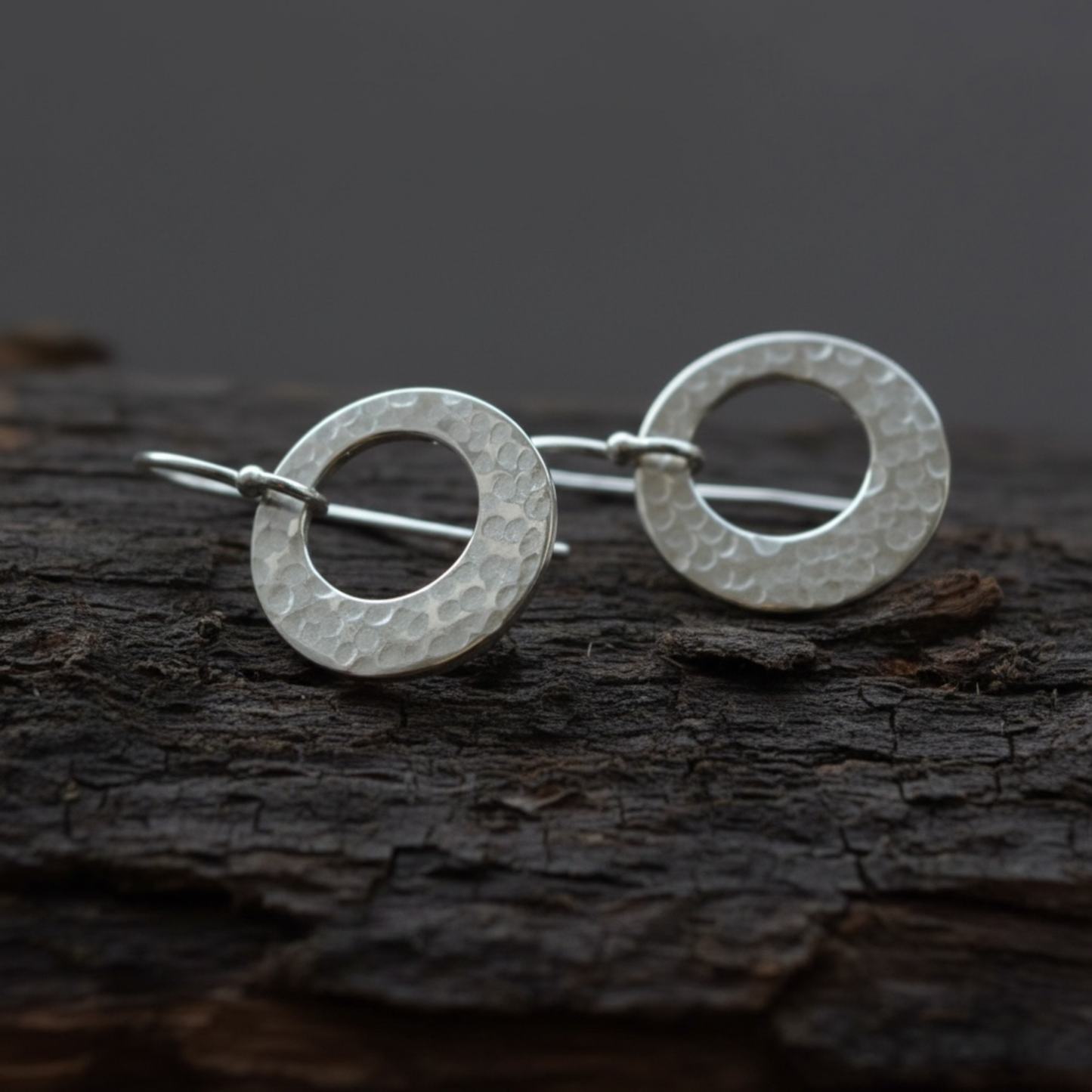 Hammered circle sterling silver earrings.