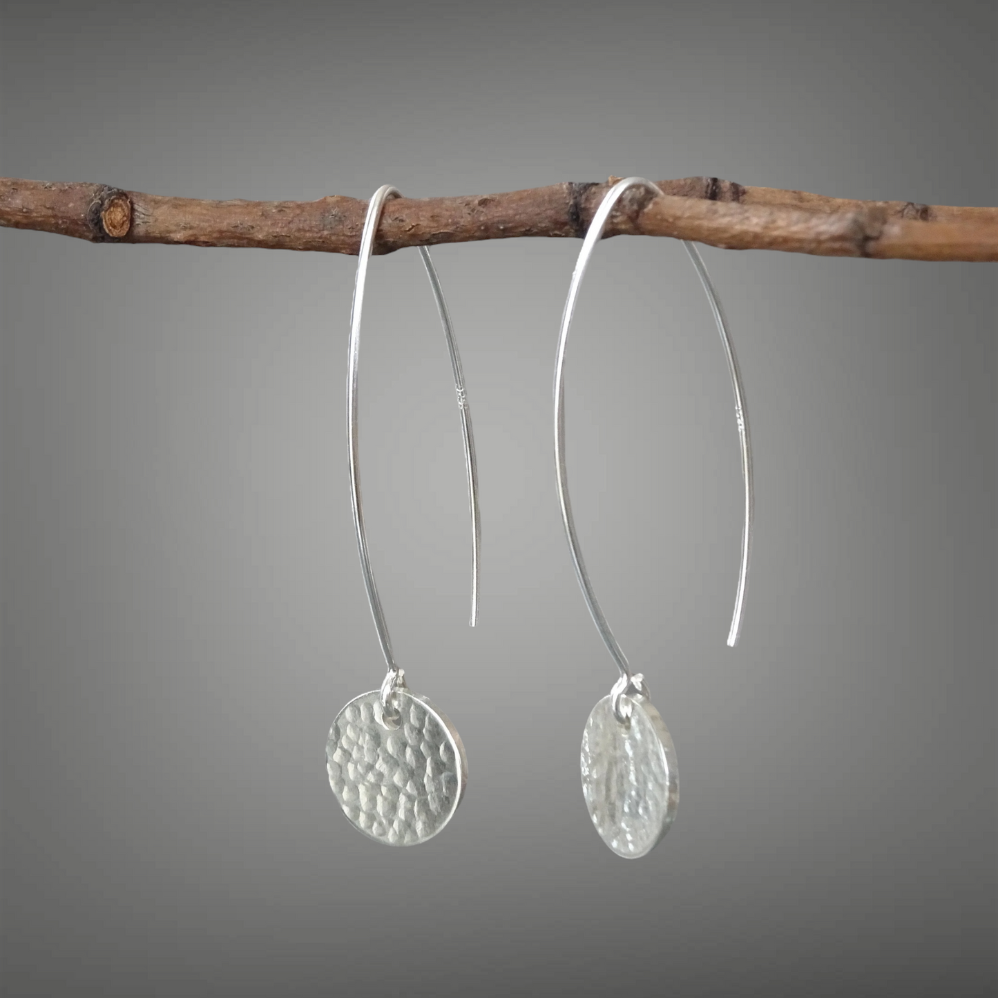 Hammerd sterling silver disc dangle earrings.