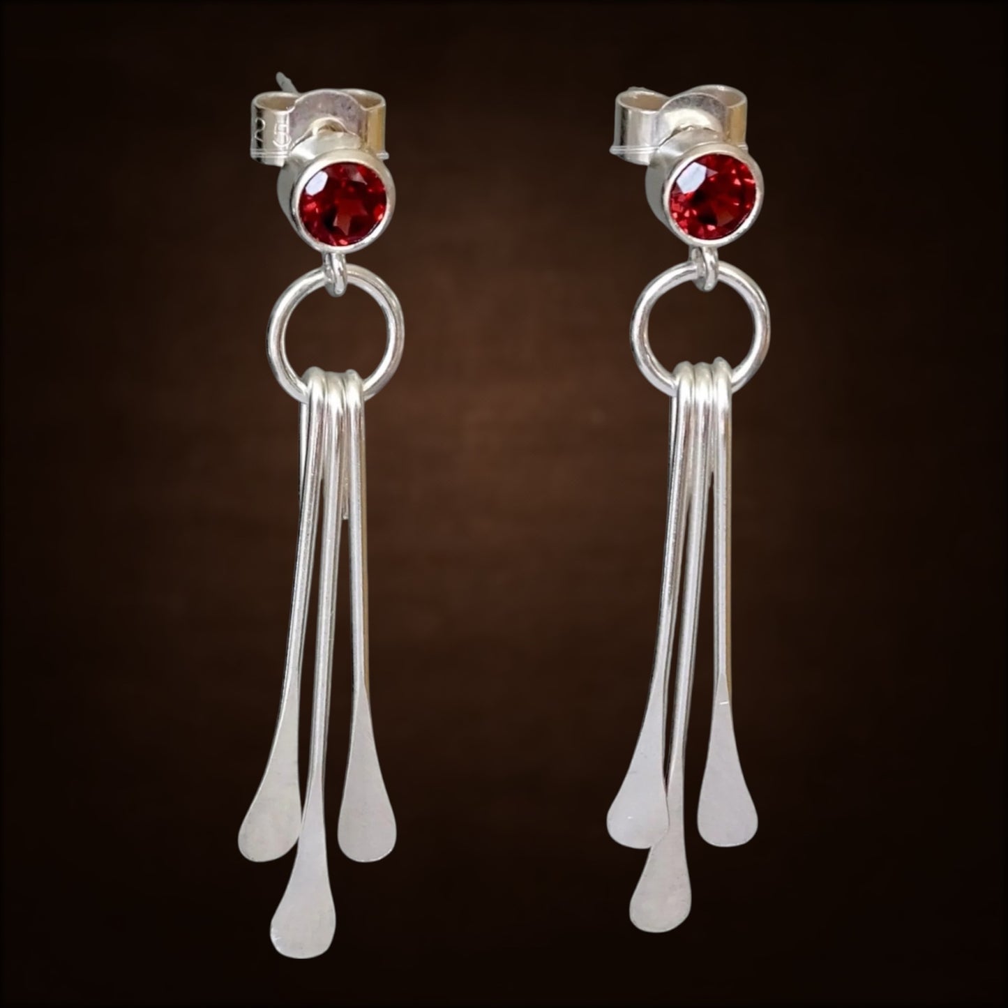 Garnet sterling silver dangle stud earrings.
