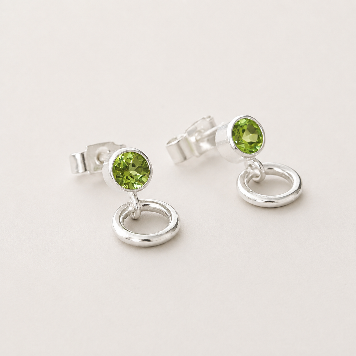 Peridot and circle sterling silver stud earrings.