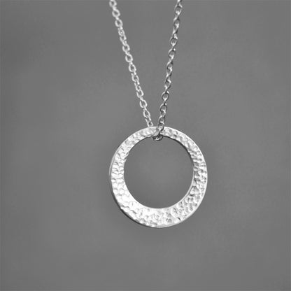 Minimalist hammered sterling silver washer necklace.