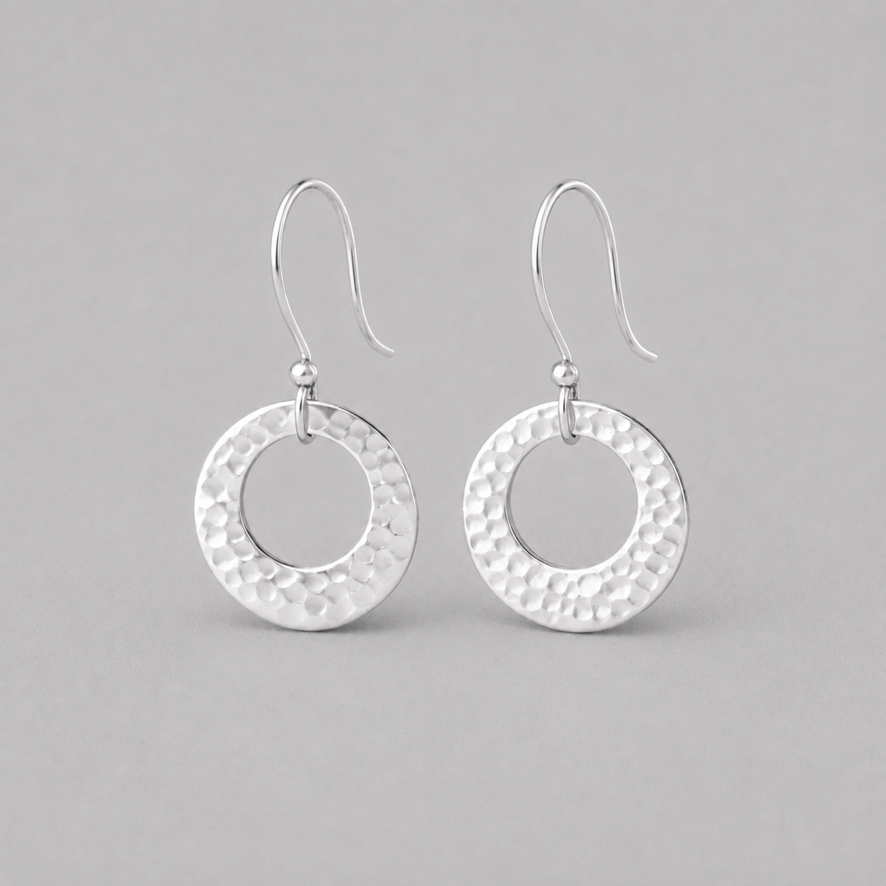 Hammered circle sterling silver earrings.