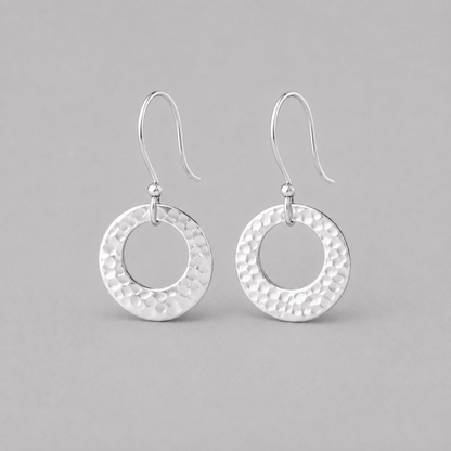 Hammered circle sterling silver earrings.