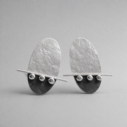 Sterling silver oval textured stud earrings. Oxidised earrings.