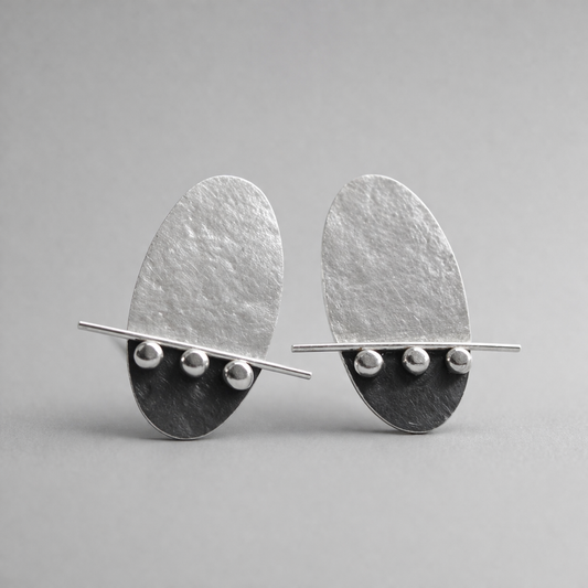 Sterling silver oval textured stud earrings. Oxidised earrings.