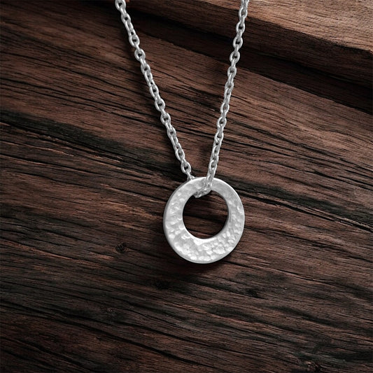 Small minimalist hammered sterling silver necklace.