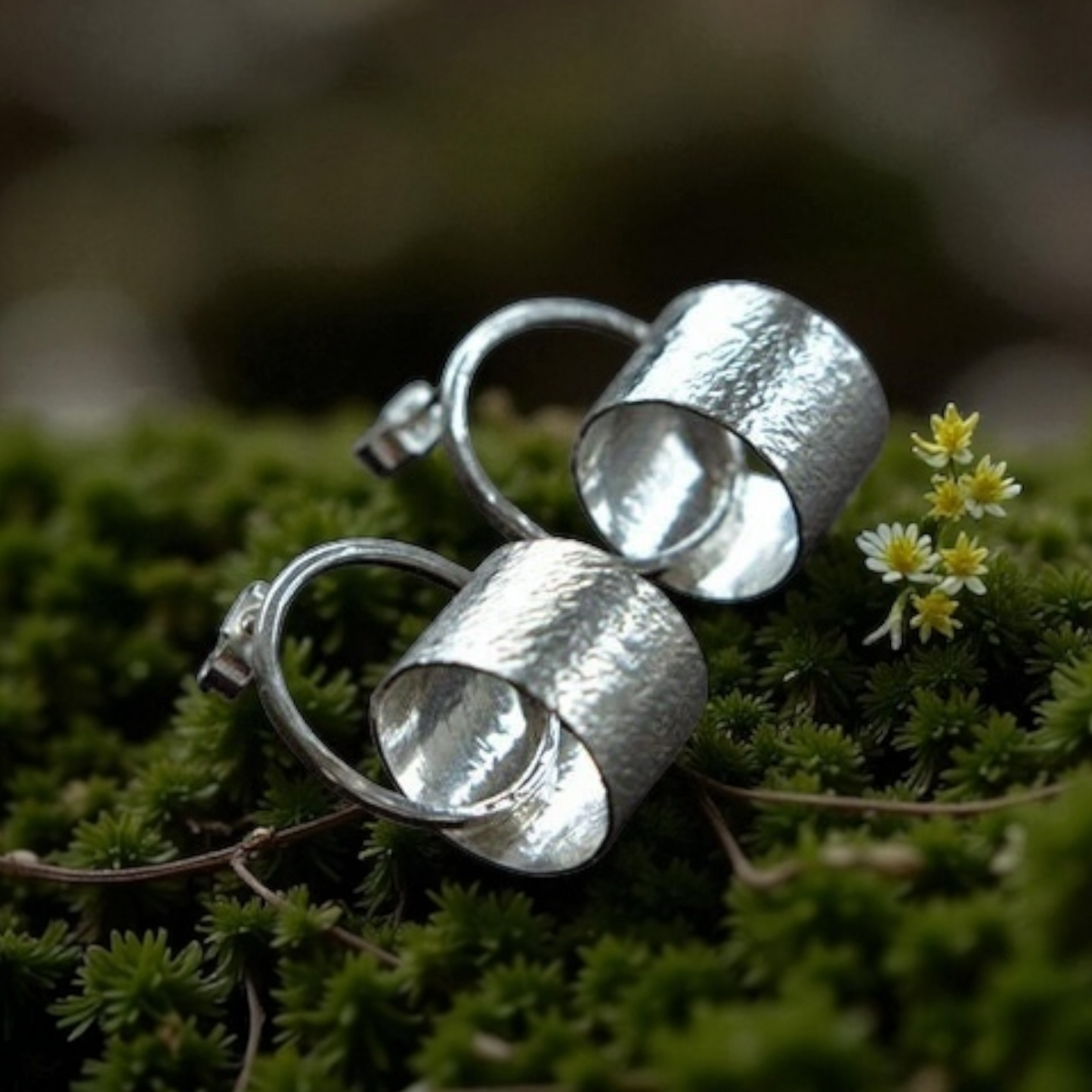 Sterling silver circle stud earrings.