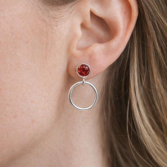 Garnet sterling silver circle earrings.