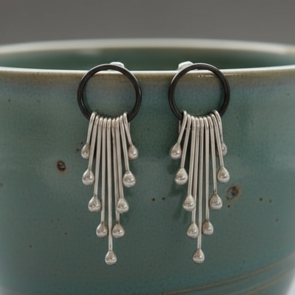 Sterling silver dangle earrings.