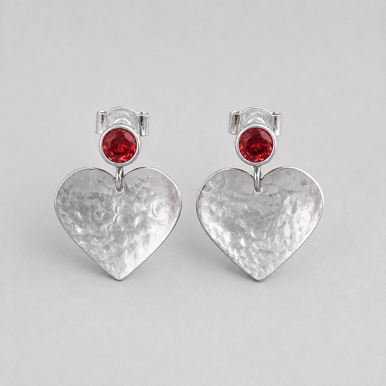 Garnet January birthstone sterling silver heart stud earrings.